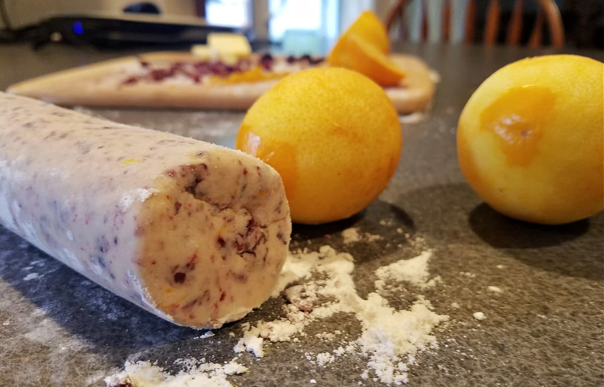Dough roll, with zested Meyer lemons in the background.