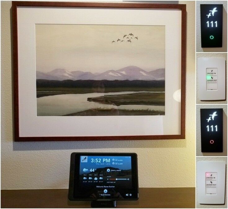 Clock with weather information below picture of geese flying over a quiet coastal scene. 