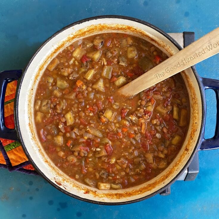 Cooked Armenian Lentil Stew in a large cast iron Dutch oven.