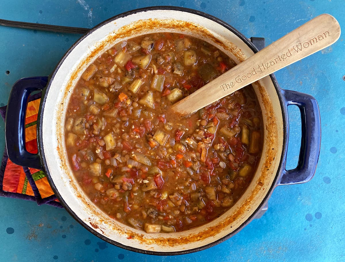 Cooked Armenian Lentil Stew in a large cast iron Dutch oven.
