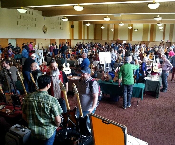 Long shot of attendees at NW Handmade Instrument Exhibit, Marylhurst University 2018 