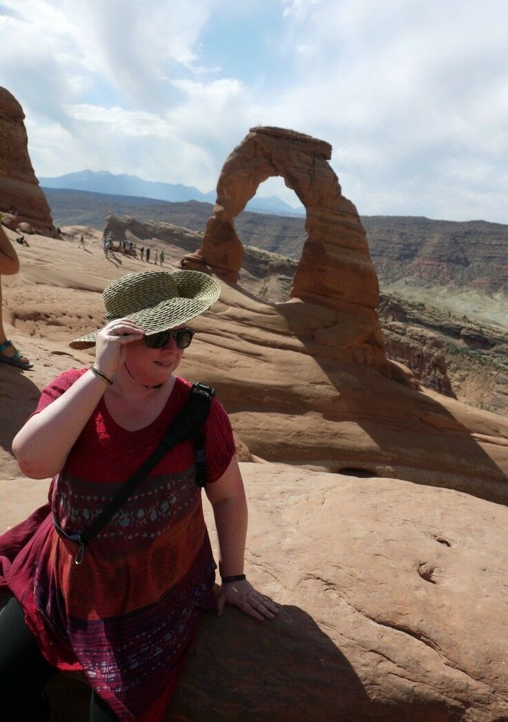 Proof of Life on Delicate Arch - "Mom, hold your hat and pose like a blogger!" [Olivia Huskey Photography]