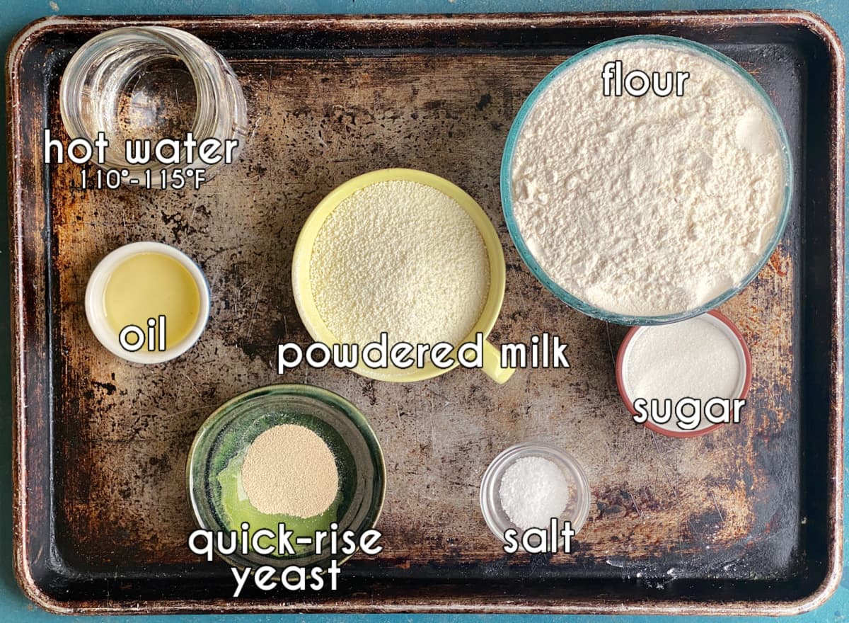 Photo of individual ingredients that go into this easy pizza dough recipe, measured and prepped.