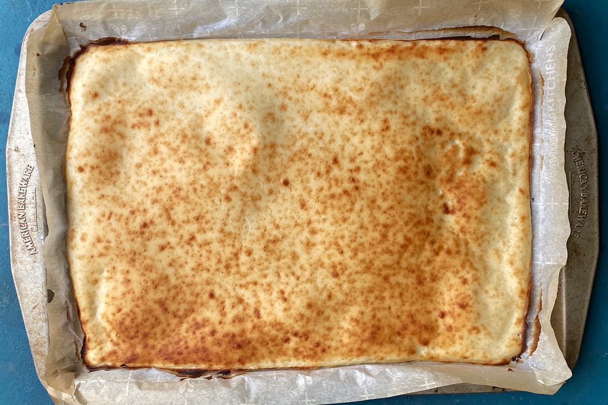 Par baked pizza crust in baking sheet.