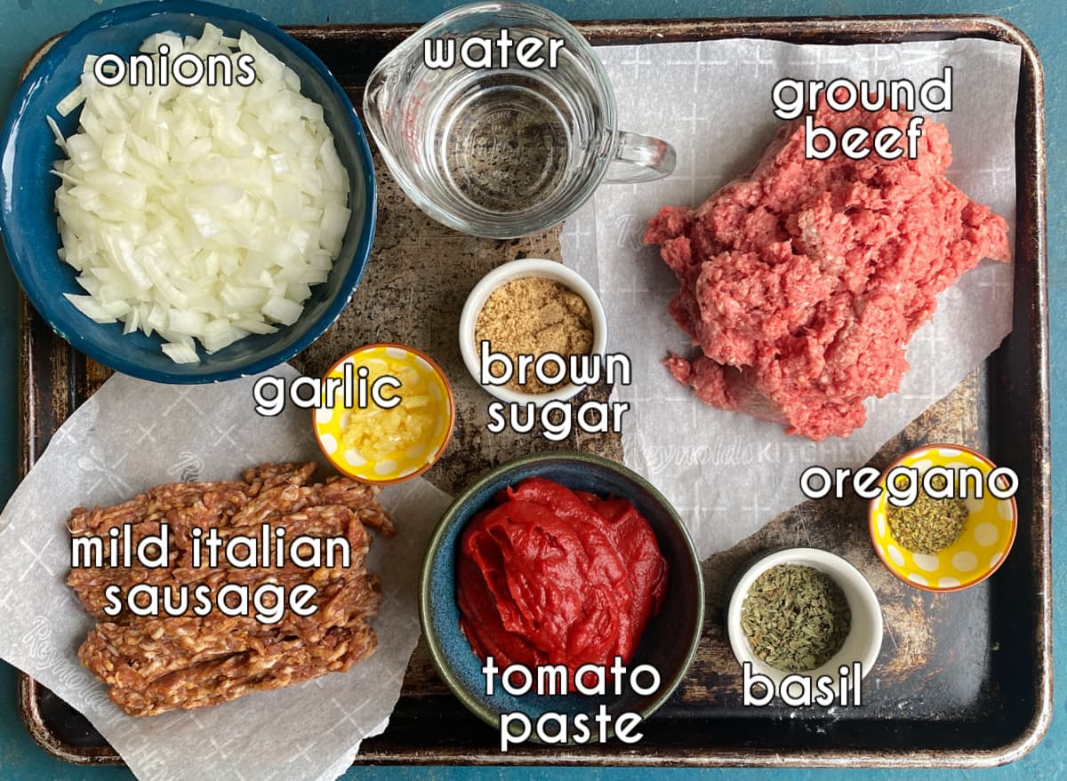 Photo of individual ingredients that go into the school pizza meat sauce portion of this recipe, measured and prepped.