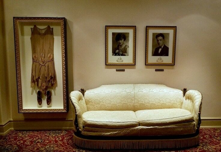 Couch and vintage dress (framed) in sitting room at Plaza theater. 