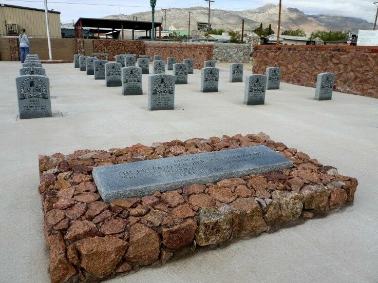 Lines of upright headstones with symbols and inscriptions for Buffalo Soldiers.