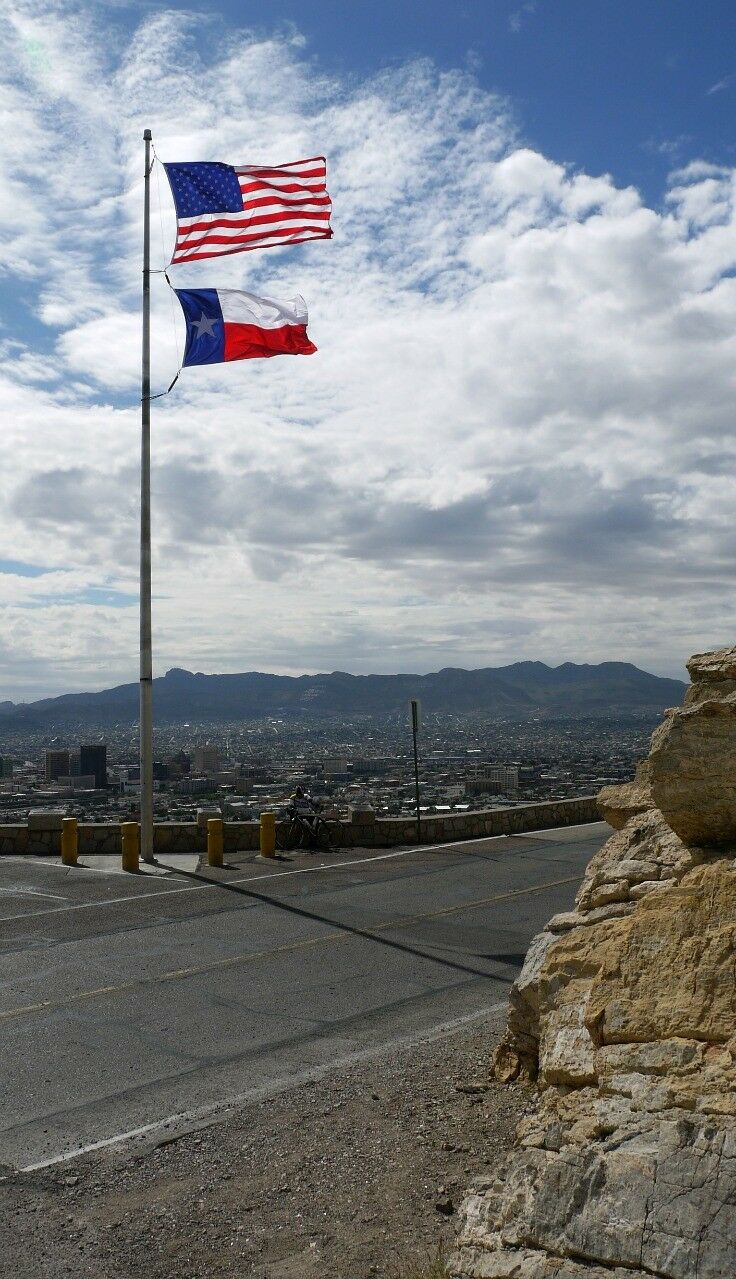 US and Texas flag flying over the Scenic Drive