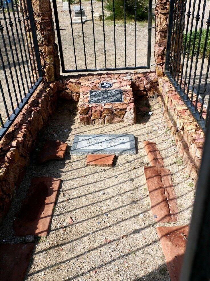 Shot of the inside of the enclosure, with the headstone of John Wesley Hardin in view. 