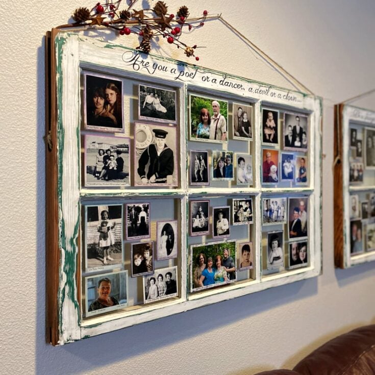 Two old window frames hung on wall next to one another; panels filled with matted photos.