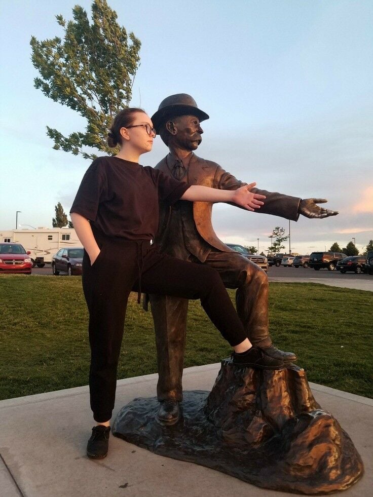 Em posing with the statue of Twin Falls founder, I.B. Perrine.
