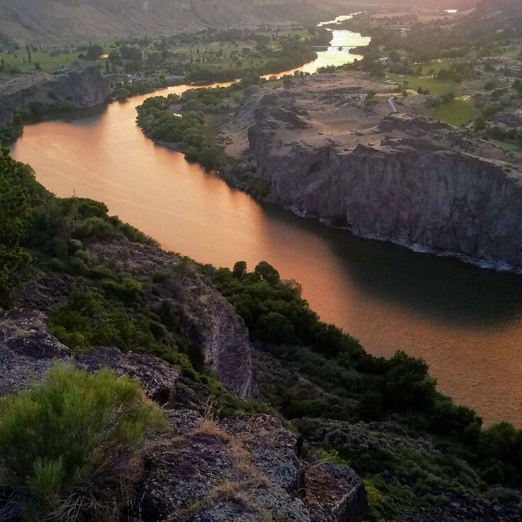 Spectacular view of the Snake River at sunset; the water reflecting like liquid copper.