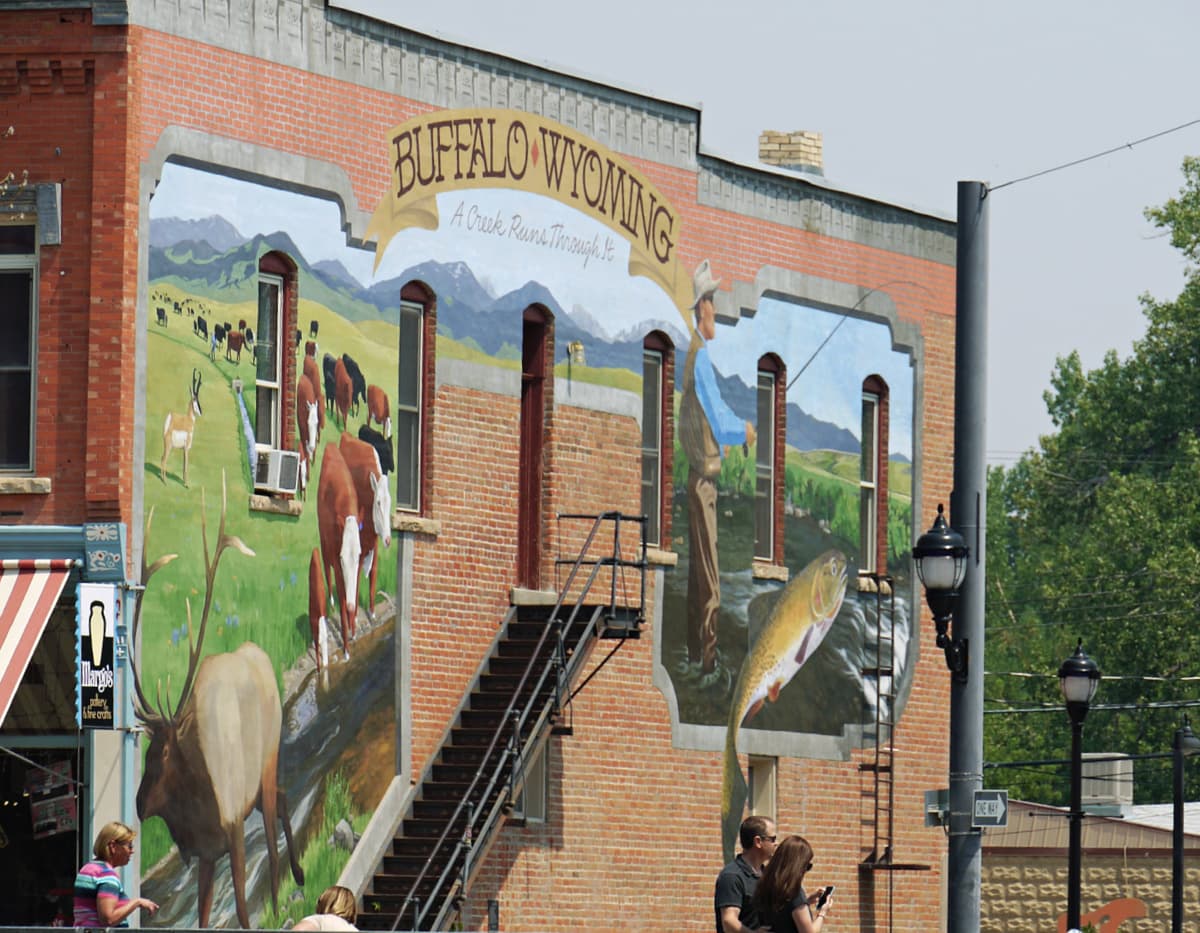 Mural on side of brick building. 