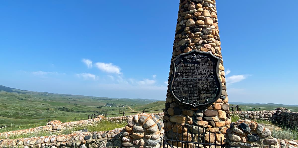 Fetterman Battle Monument - a stone pillar with a large plaque on it, recognizing the loss of white lives during this battle. 