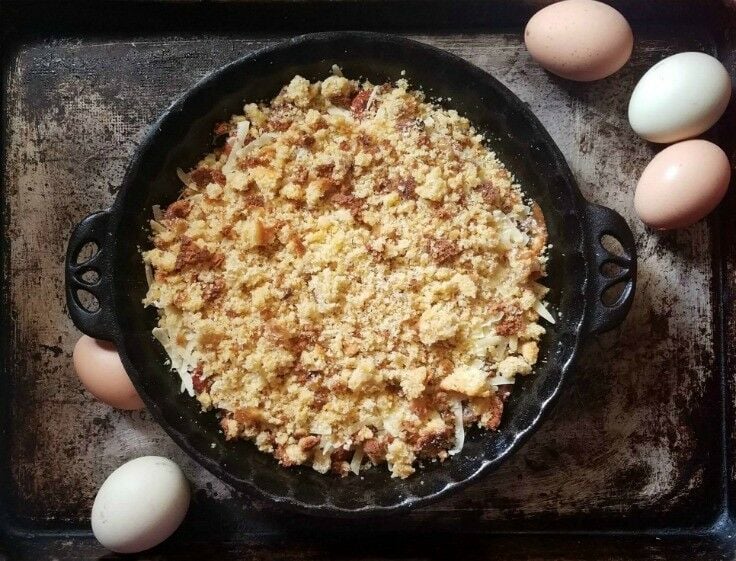 Cornbread crumbs in a cast iron pie dish. 