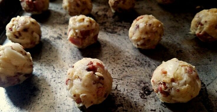 Formed fritter balls on baking sheet. 