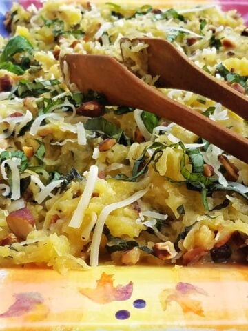 Baked spaghetti squash mixed with herbs, nuts, and cheese.