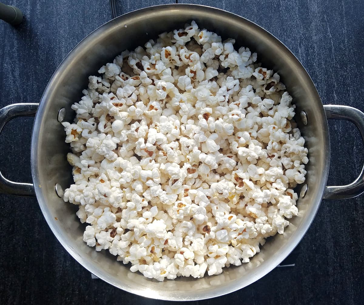 Overhead shot of popped popcorn in a stockpot. 