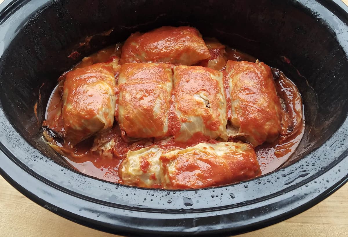 Cooked cabbage rolls in a slow cooker, cooked.