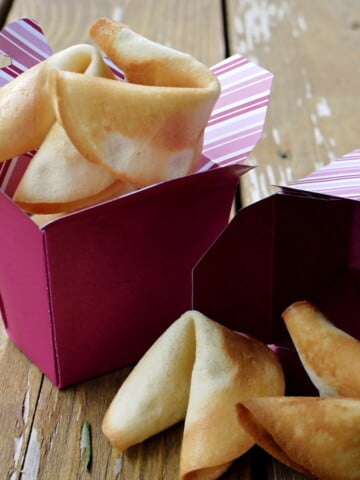 Fresh fortune cookies in Chinese takeout box.