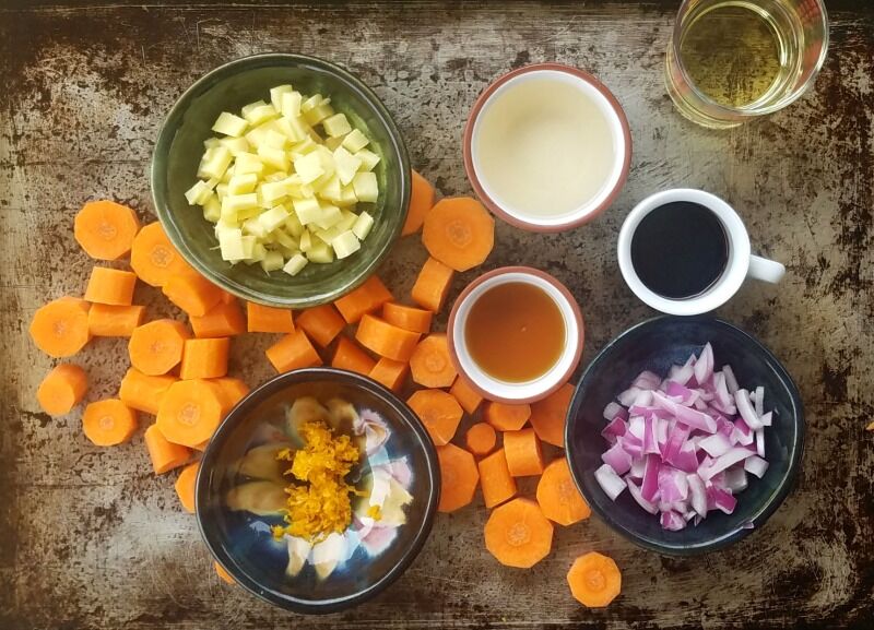 Carrot Ginger Dressing ingredients: carrots, ginger, orange zest, sesame oil, seasoned rice vinegar, soy sauce, onion, water. 