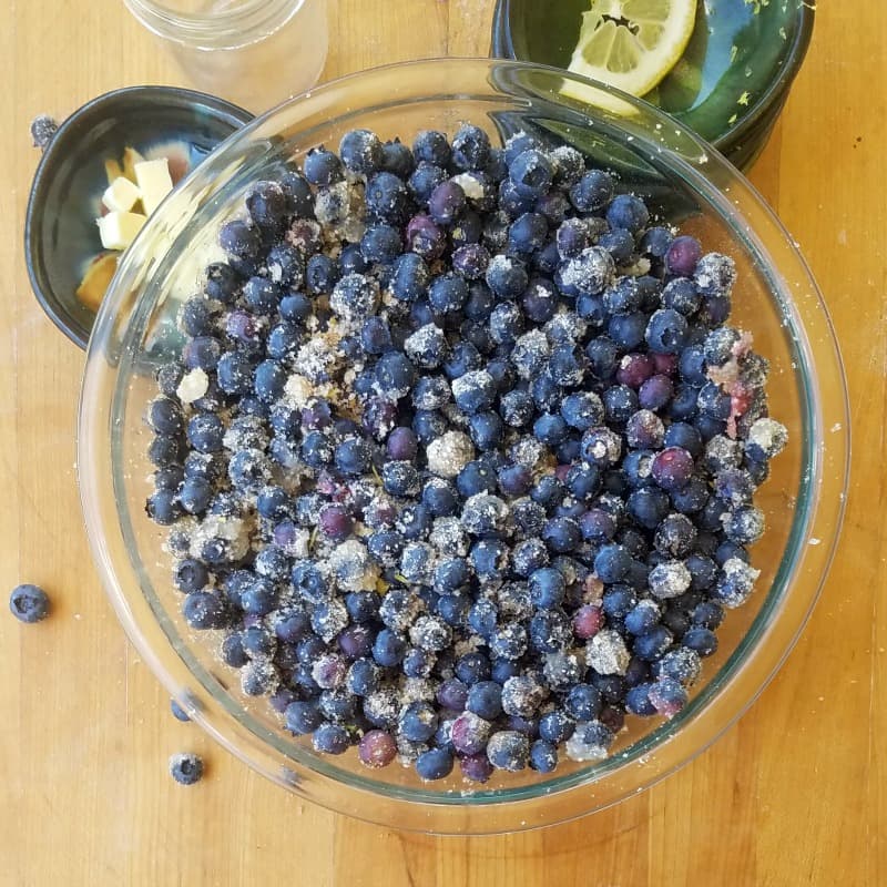 blueberry pie filling mixed in a glass bowl. 