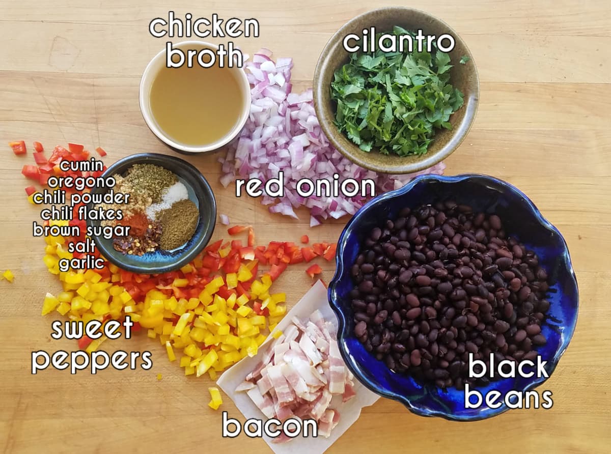 Spicy black beans ingredients: sweet peppers, bacon, cilantro, chicken broth, red onion, black beans, garlic and spices.