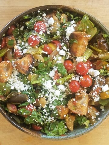 Large panzanella salad in family-sized serve bowl.