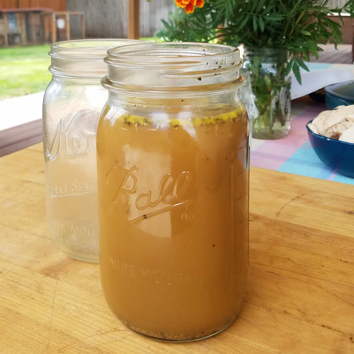 Quart Mason jar filled with concentrated chicken stock. 