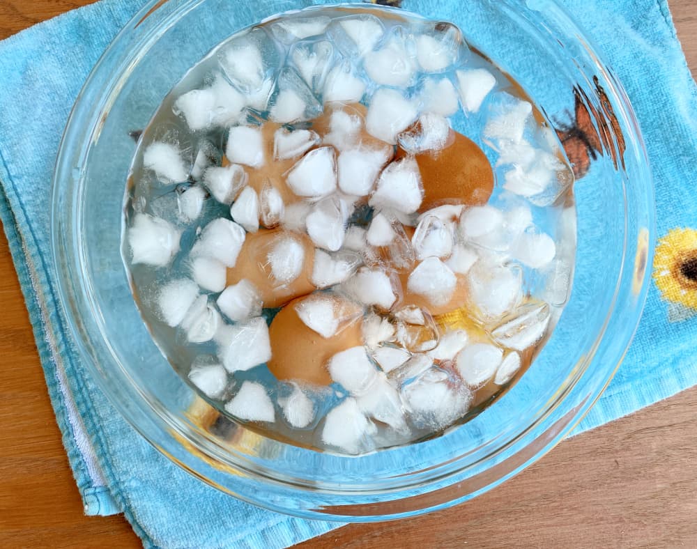 Boiled eggs in ice water bath