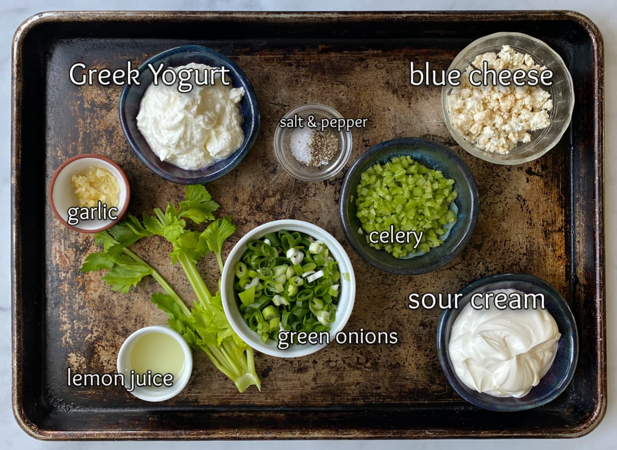 Blue Cheese dip ingredients in bowls on a baking tray.