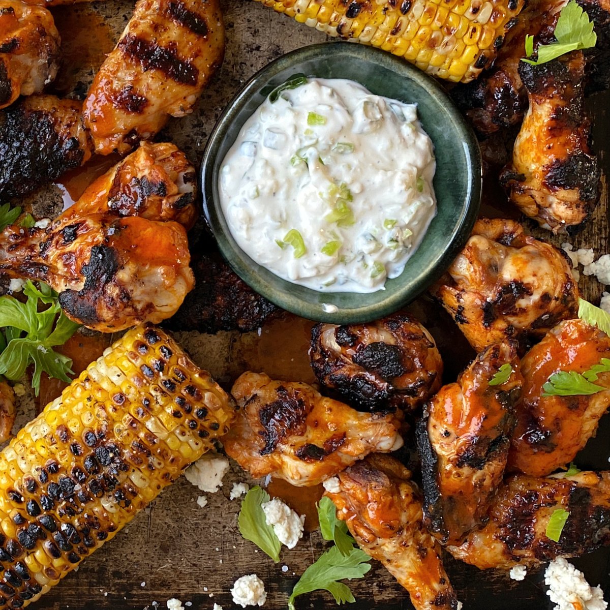 Buffalo Blue Cheese Dip with wings and grilled corn.