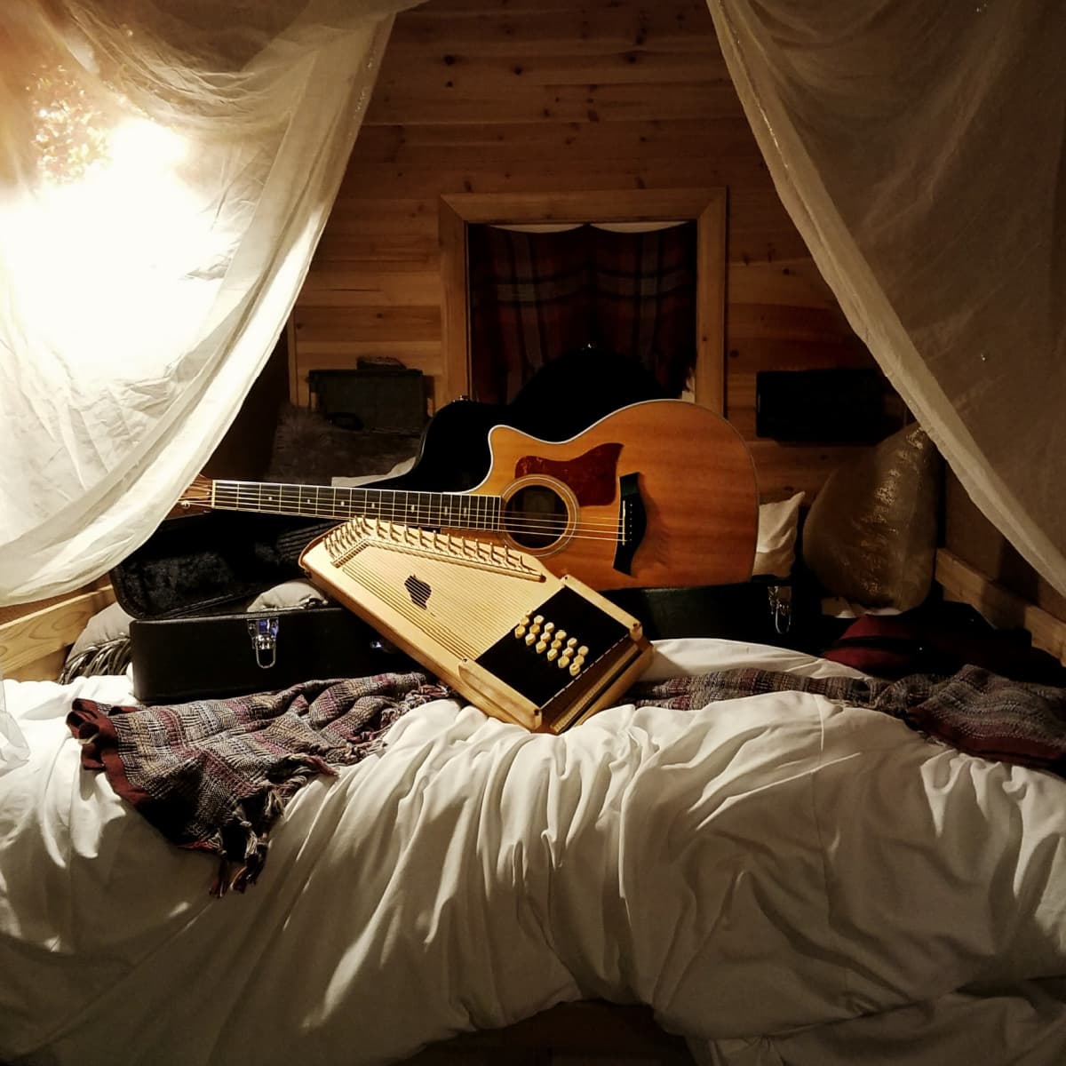 Autoharp and guitar in boho tiny home.