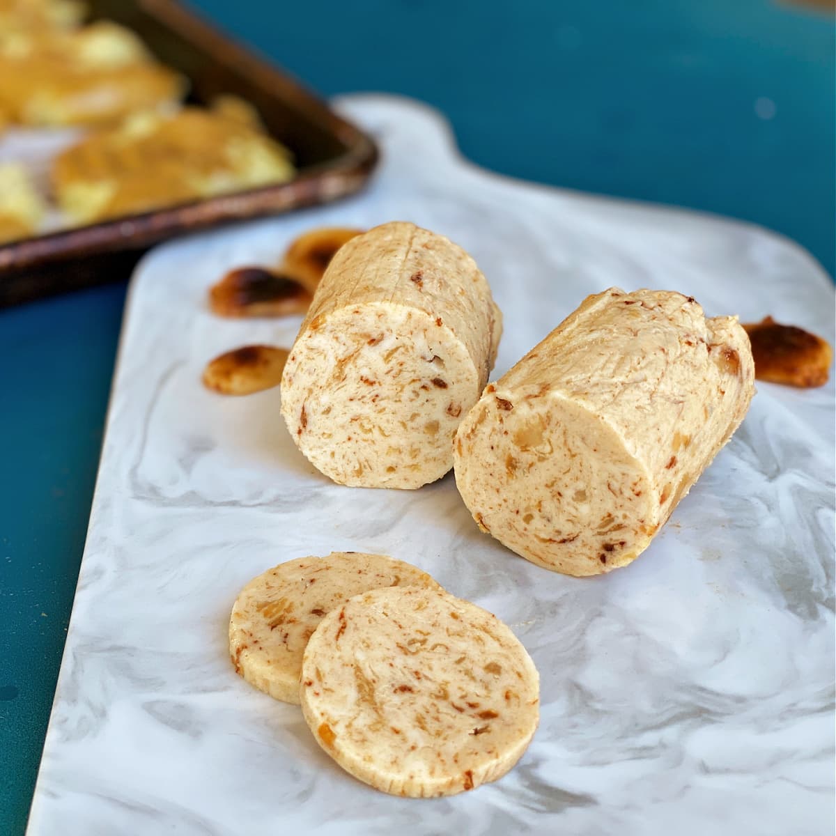 Roasted garlic compound butter on serving board.