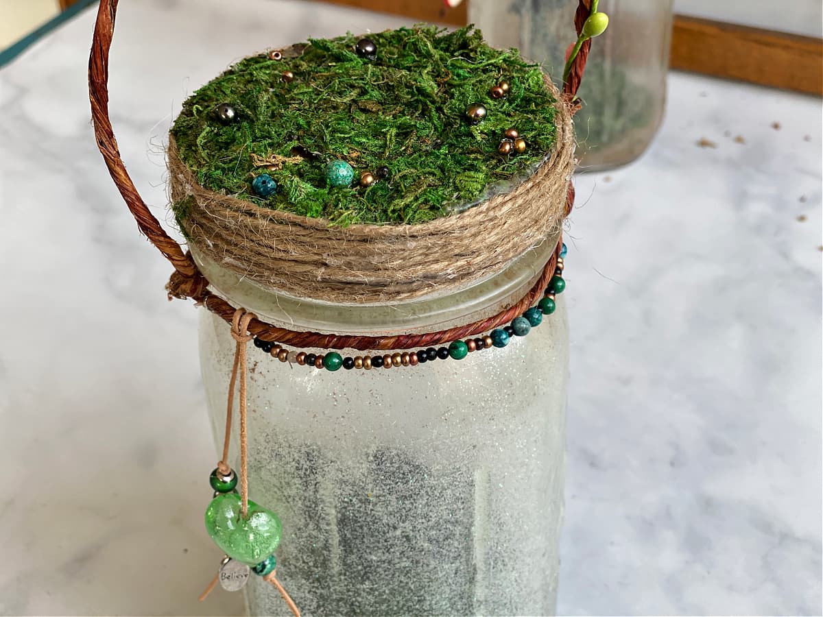 Embellishment on top and around rim of the bale attached to the Mason jar light. 