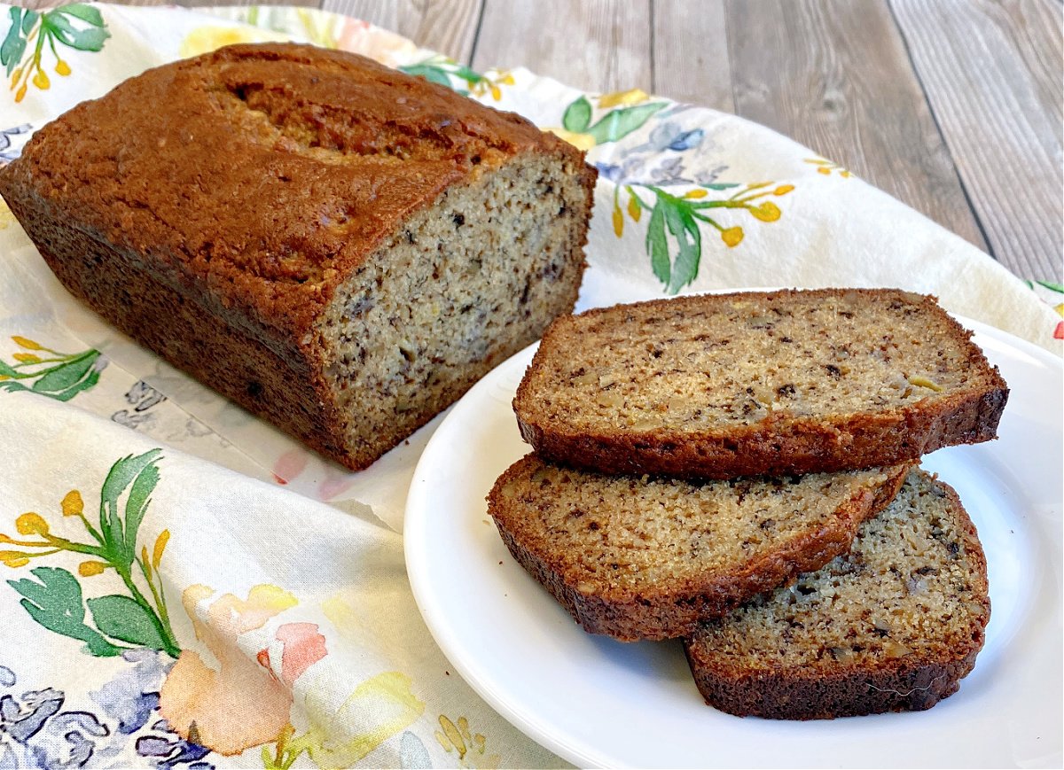 Three slices of banana bread on a white plate.