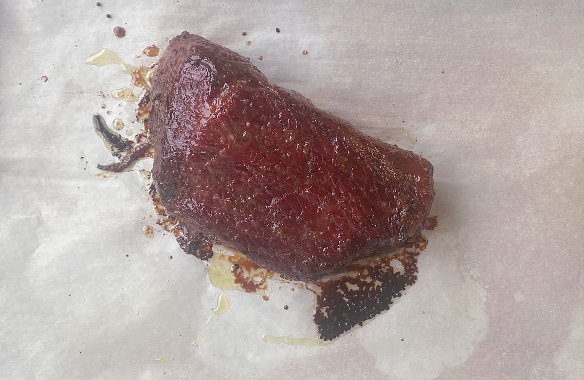 Close-up of caramelized glaze on corned beef. 