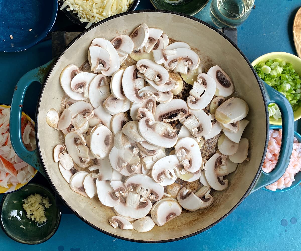 sliced mushrooms and butter in a skillet.