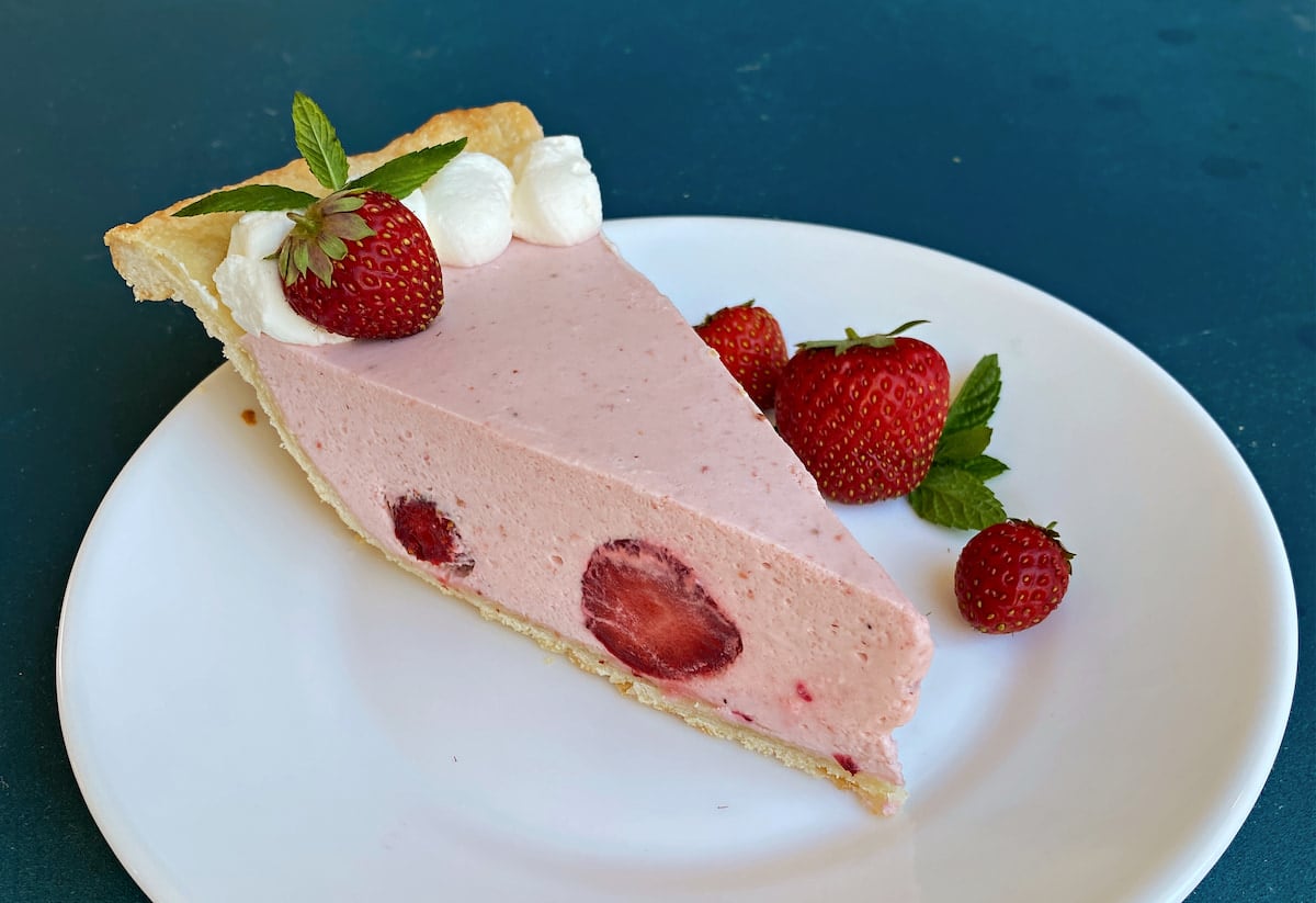 Slice of strawberry pie on a dessert plate.