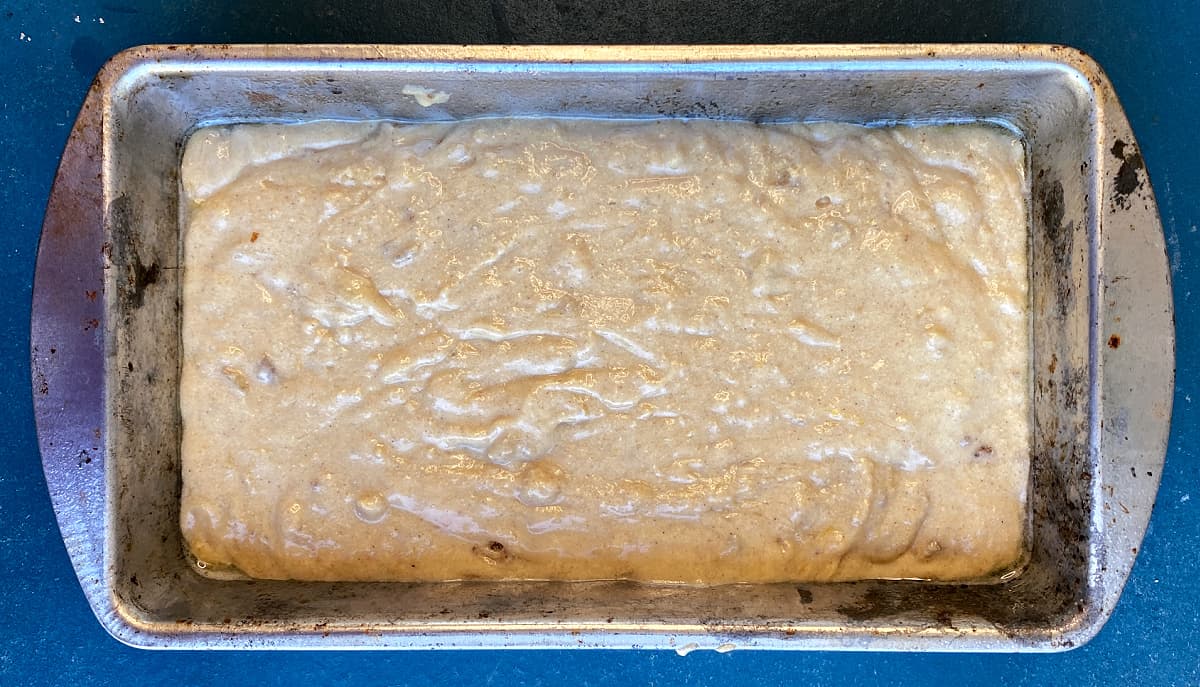 Quick bread batter poured into loaf pan, ready to bake.