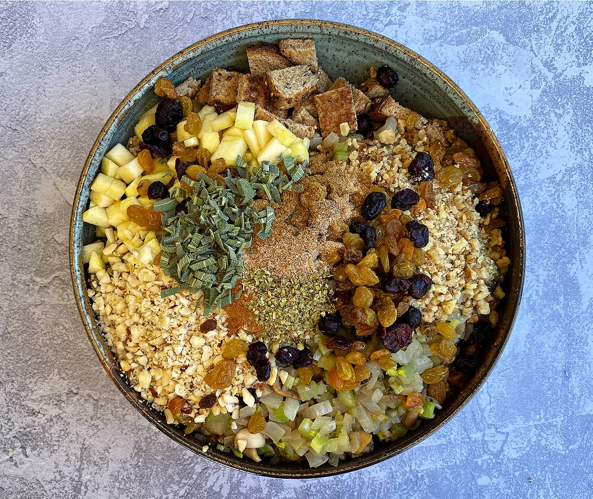 Dry stuffing ingredients in a large pottery bowl.