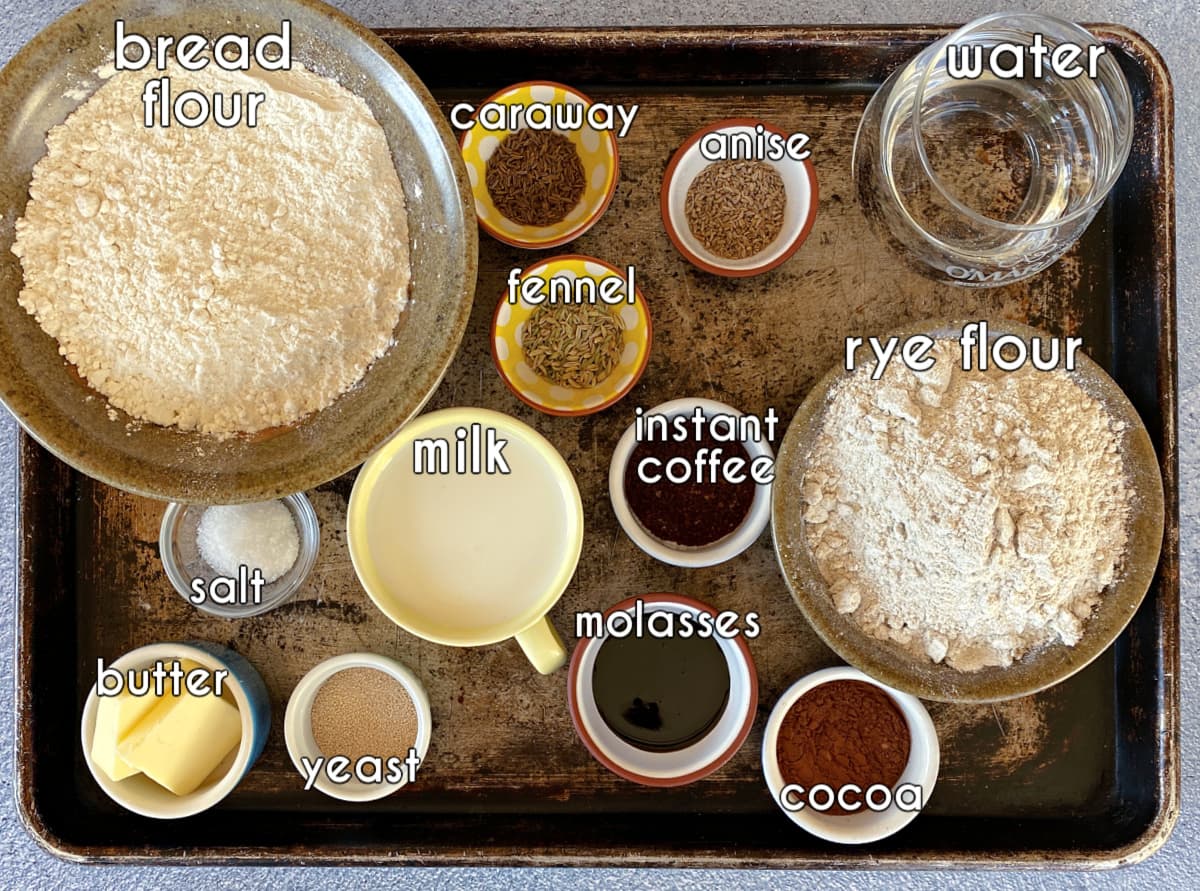 rye-bread-ingredients, labeled: bread flour, rye flour, caraway, anise, fennel, molasses, yeast, butter, cocoa, instant coffee, milk, salt, and water. 