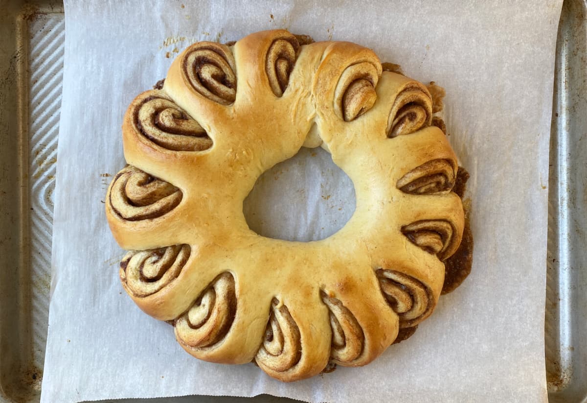 Baked cinnamon roll ring before icing.