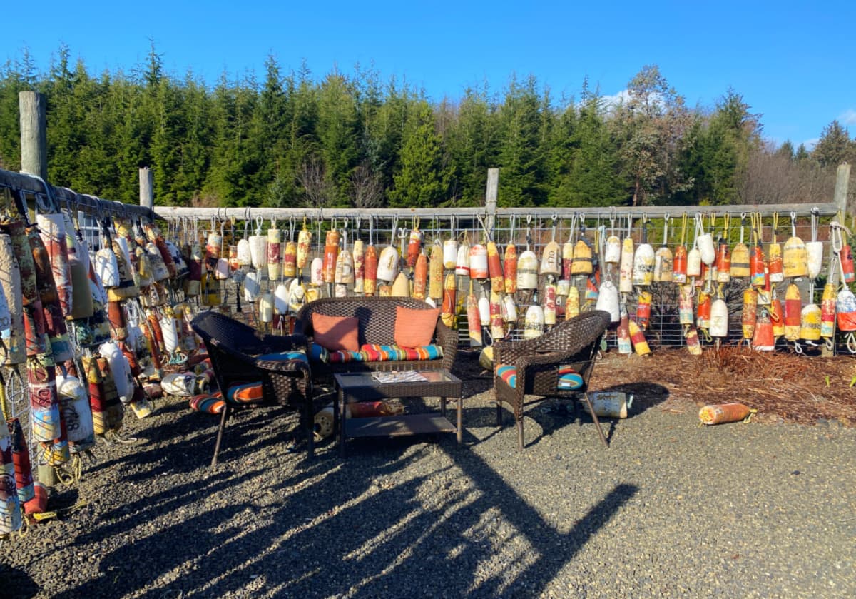 Bouys strung and hung on fence to create game space.