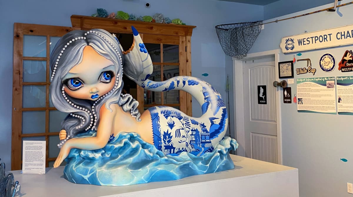 Stylized mermaid with Asian-meets-Delft pattern painted on her tail.