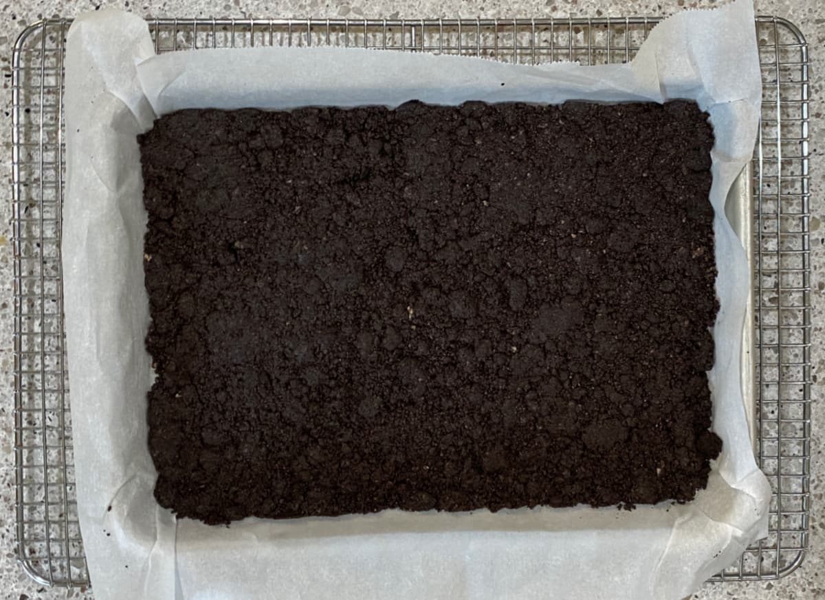 Oreo cookie layer baked and cooling.