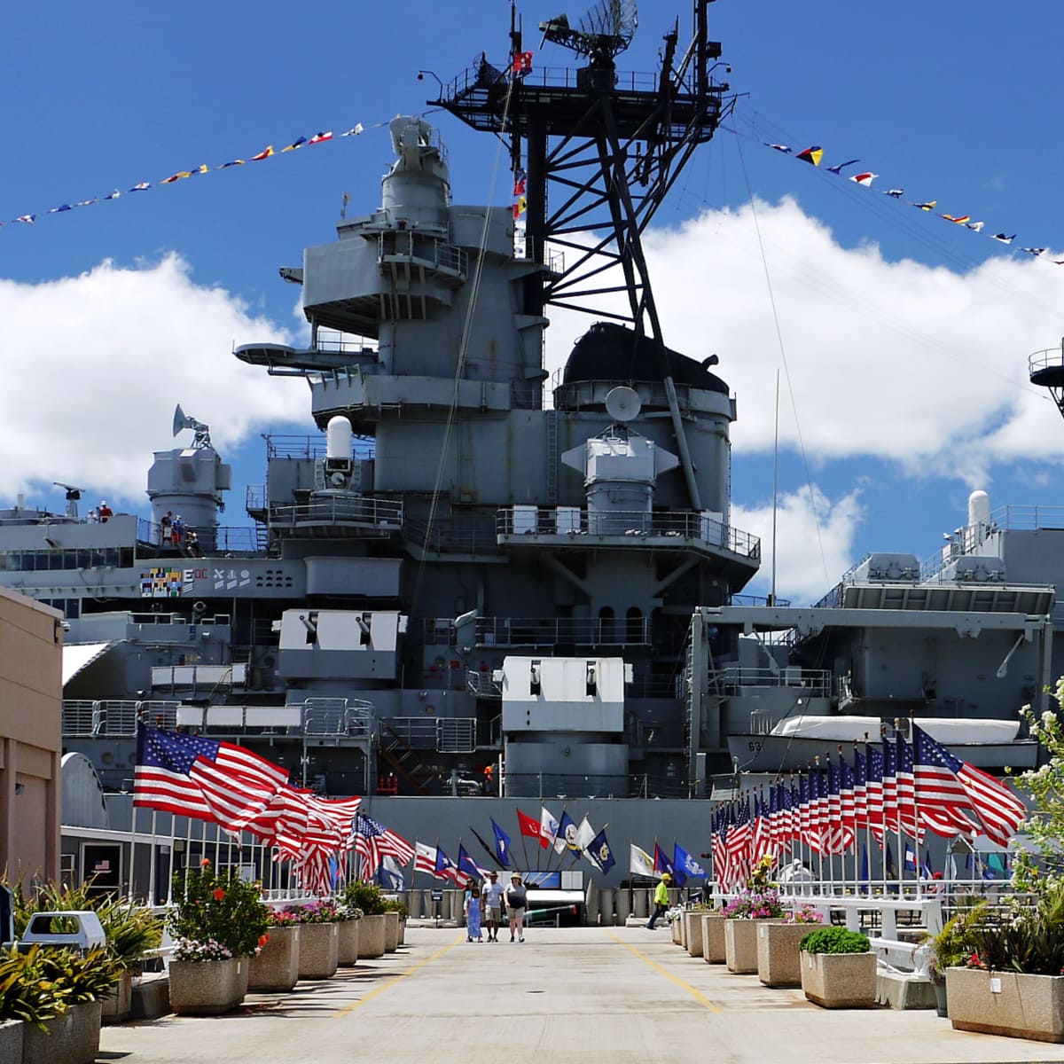 Flag-lined concourse leading the USS MIssouri. 