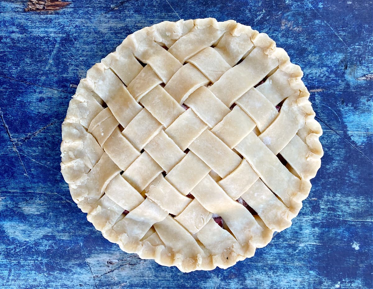 Pie filled, topped with lattice, and ready to bake.
