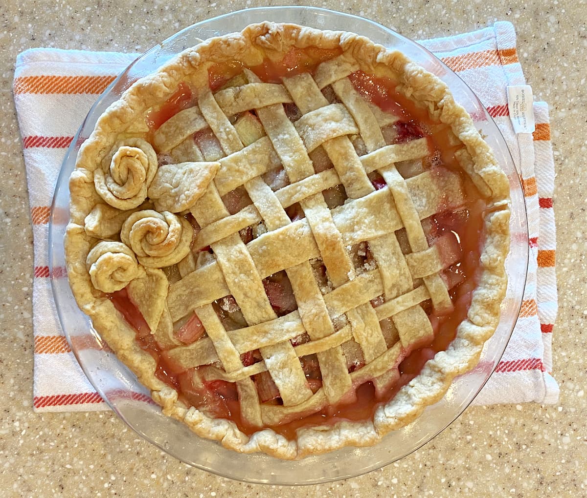 Baked pie with lattice top and pastry roses.