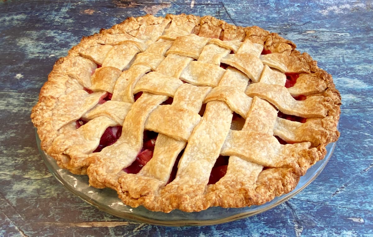 Baked rhubarb pie with lattice top.